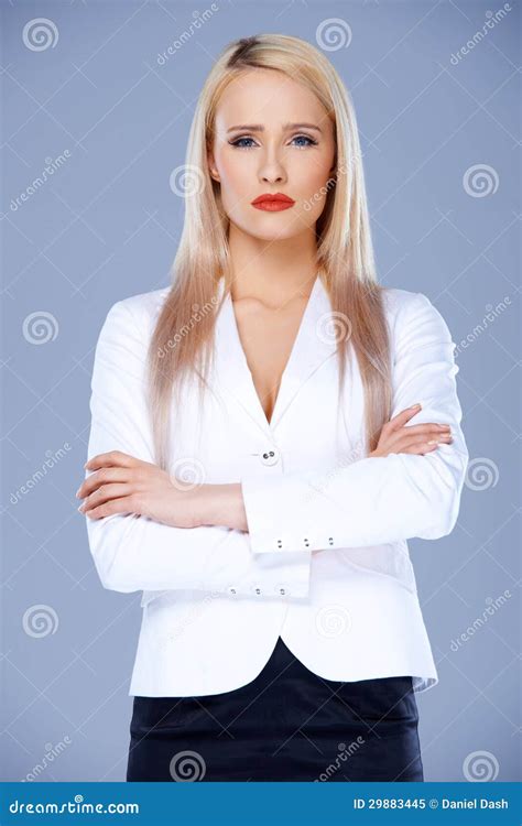 Sophisticated Business Woman Posing With Arms Crossed Stock Image