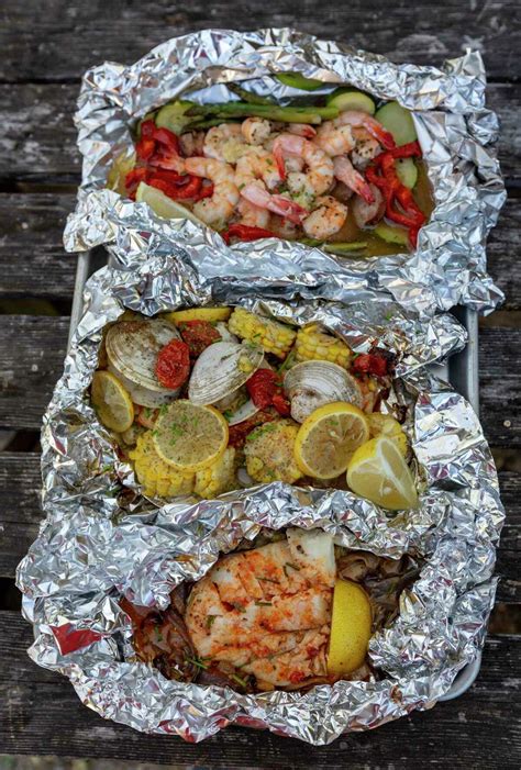 Chucks Food Shack Cooking Seafood In Foil Packets Makes For An Ocean