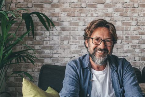 Portrait Of Handsome Happy Mature Man Looking At Camera And Smiling In