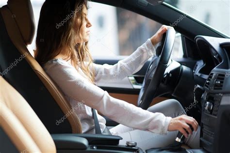 Young woman driving her car Stock Photo by ©minervastock 59864485