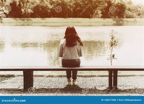 Sad Girl Sitting Alone On Bench