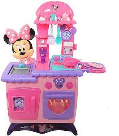 A Toy Kitchen With Minnie Mouse Cooking Food