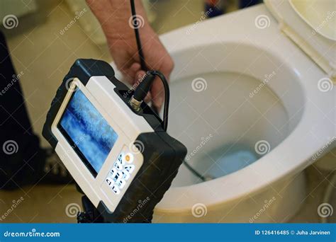 Checking Clogged Toilet Pipe With Inspection Camera Stock Image