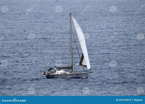 Sailing Yacht With White Sail On Open Water Stock Photo Image Of