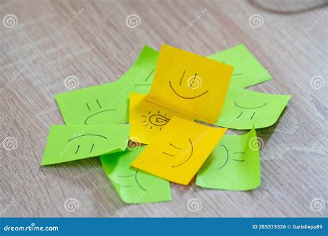 Smiley And Angry Faces Are Drawn On The Sticker Sheets Stock Photo