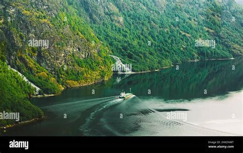 The Ship Floating In The Water In Narrowest Fjord In Norway