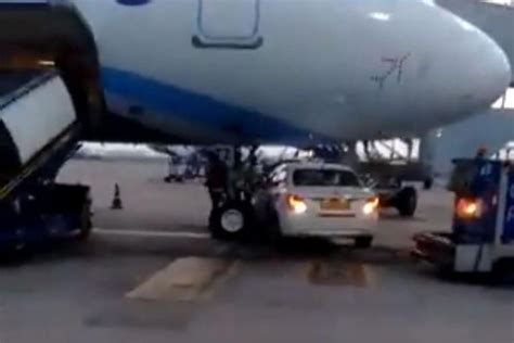 Delhi Airport Car Goes Under Indigo Plane Narrowly Watch Video Indigo