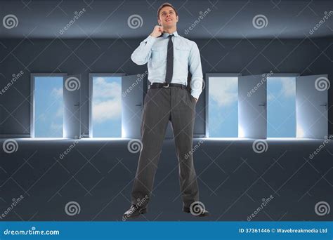 Composite Image Of Smiling Businessman Holding His Jacket Stock Photo