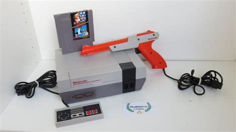 Nintendo NES incl Mario/Duck Hunt, controller & zapper - Catawiki