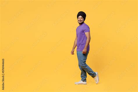 Full Body Fun Side View Smiling Cheerful Devotee Sikh Indian Man Ties His Traditional Turban