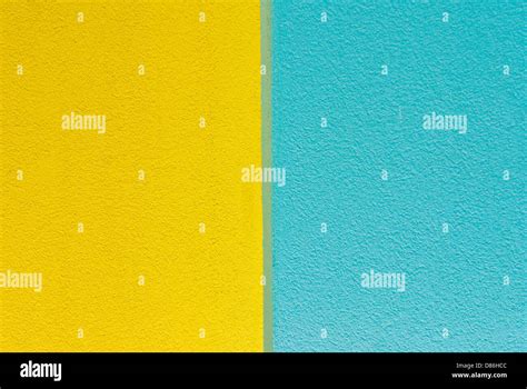 Wall of blue and yellow textured paint Stock Photo - Alamy