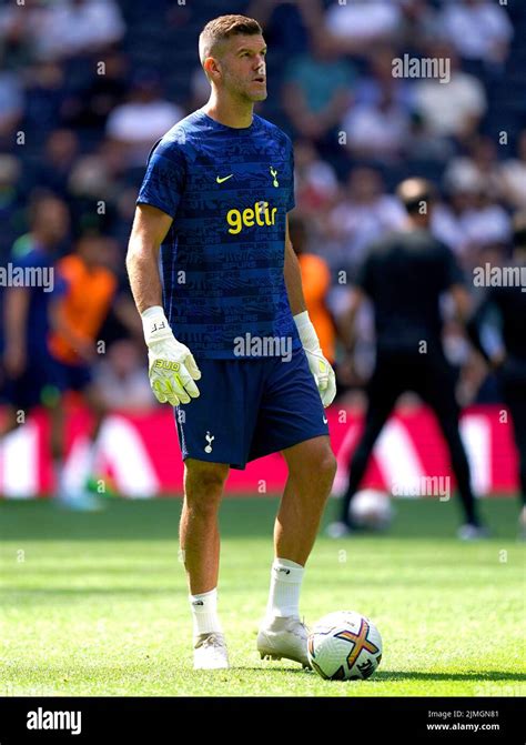 Tottenham Hotspur Goalkeeper Fraser Forster Warms Up On The Pitch Ahead