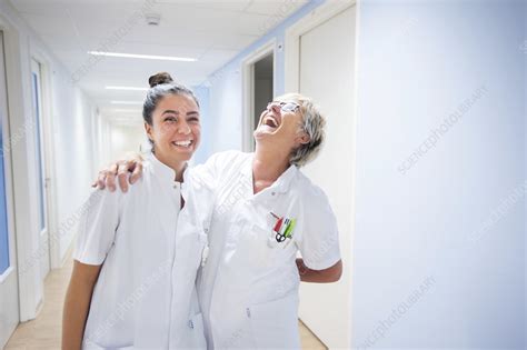 Nurses Laughing In Corridor Stock Image F0289633 Science Photo