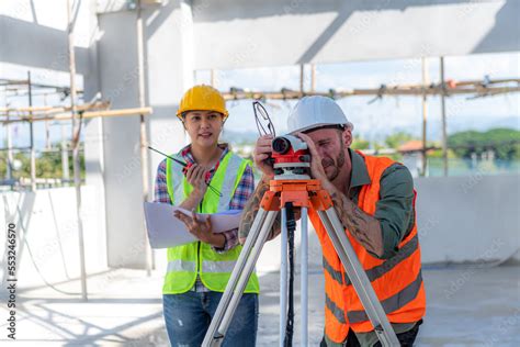 Construction Worker Using Theodolite Surveying Optical Instrument For