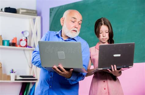 Modern Pedagogue Teacher Help School Girl Little Girl With Man Tutor