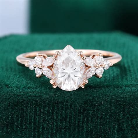 Pear Cut Moissanite Blossom Engagement Ring Double Claw Setting