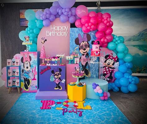 A Birthday Party Set Up With Balloons And Mickey Mouse Decorations On