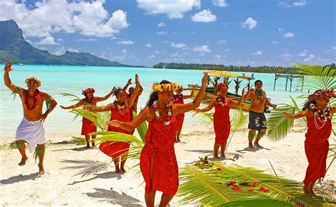 Tahitians Dance On White Sand Beach On Paradise Island Bora Bora Near