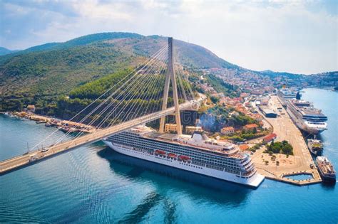 Aerial View of Cruise Ship Under Beautiful Bridge at Sunset Stock Photo ...