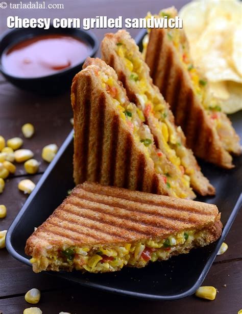 Corn Grilled Sandwich Cut In Half On A Black Plate Next To Chips And