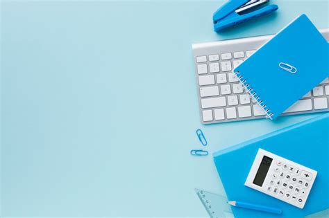 Premium Photo Blue Stationery And Keyboard Copy Space