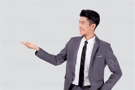 Portrait Young Asian Business Man In Suit Presenting Isolated On White