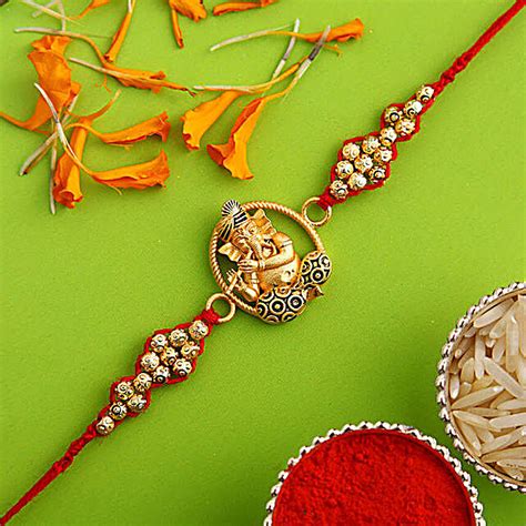 Buy Send Sneh Golden Charm Ganesha Rakhi Online Fnp