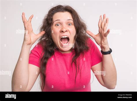 Portrait Of A Frustrated Angry Screaming Woman Screaming Out Loud On