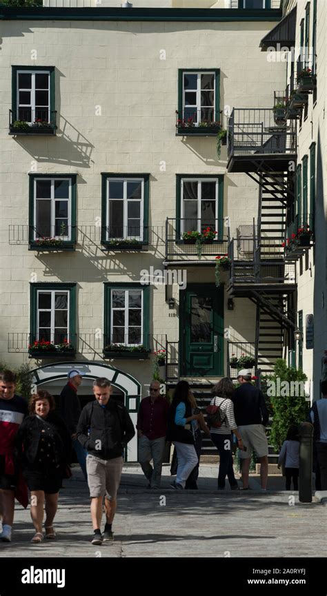 Tourists Walking Past Building At The End Of Rue Notre Dame In Old