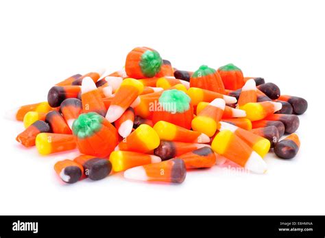 A Pile Of Different Halloween Candies On A White Background Stock Photo