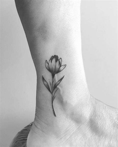 Top 109 Best Tulip Tattoo Ideas [2021 Inspiration Guide] Tulip Tattoo Tattoos Daisy Flower