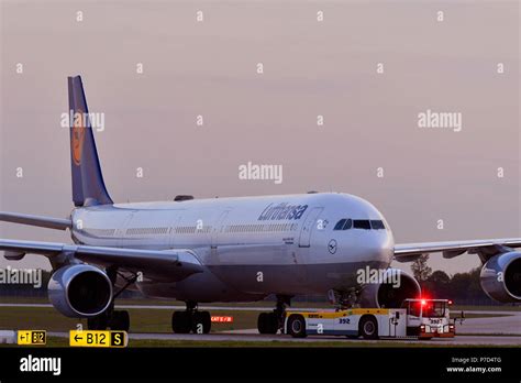 Lufthansa Airbus A340 600 With Push Back Truck Dusk Munich Airport