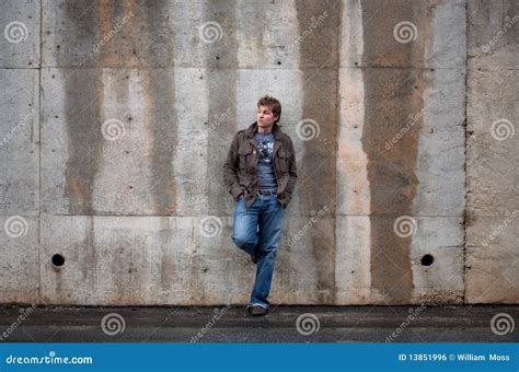 Man Leaning Against Wall Stock Photo Image Of Cement