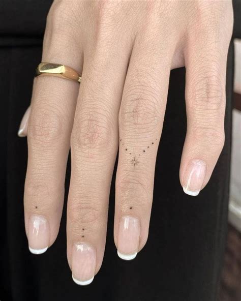 Minimalist Dots And North Star Tattoo On The Fingers Hand And Finger