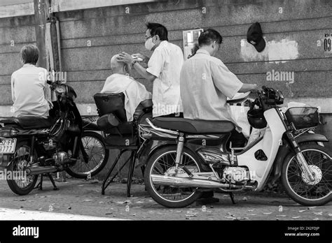 Vietnam, Ho Chi Minh City, Saigon, Street barber shop Stock Photo - Alamy