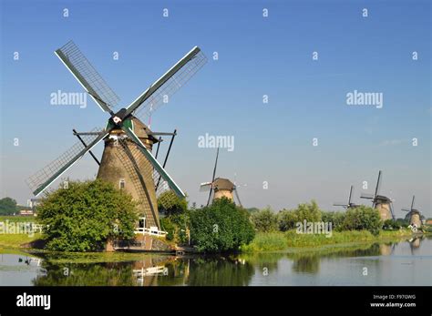 Dutch Mills Over A River Stock Photo Alamy