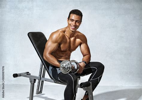 Sports Guy Resting After Work Out With Dumbbell Photo Of Handsome Smiling Man With Naked Torso