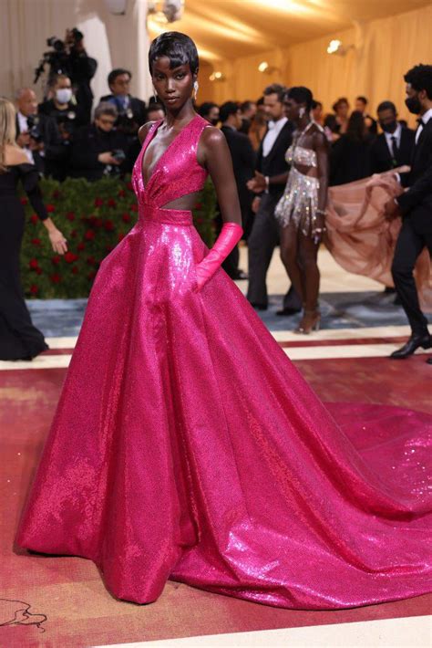 Model Anok Yai In A Hot Pink Sequined Gown By Michael Kors At The Met