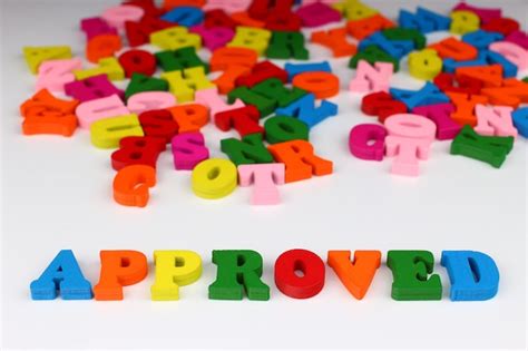 Premium Photo The Word Approved With Colored Letters