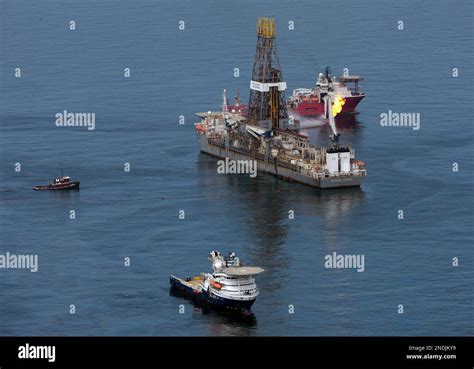 The Transocean Deepwater Discoverer Drilling Rig Operates Over The Site