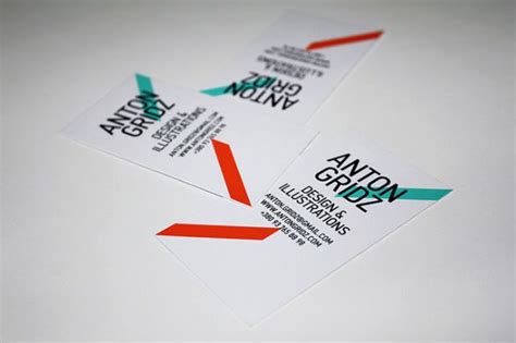 Two White Business Cards With Red Green And Blue Arrows