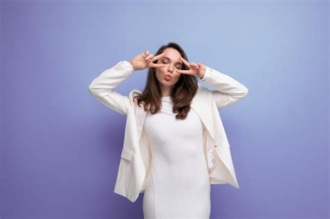 Premium Photo Charming Brunette Woman In White Dress On Blue Studio