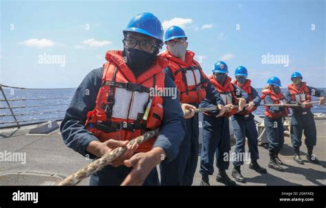 Philippine Sea April Sailors Heave A Line On The Fantail Of