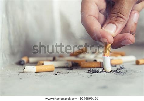 Hand Putting Out Cigarettecigarette Butt On Stock Photo