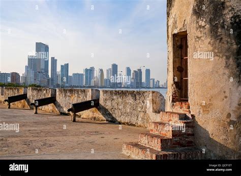 View From City Wall With Bastion And Cannons And The Skyline Of Modern