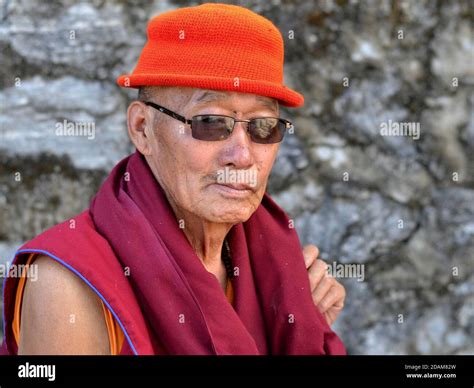 Elderly Senior Tibetan Buddhist Monk With Cheap Modern Sunglasses Wears