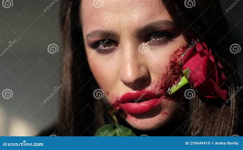 Glamorous Brunette Woman With Makeup For Halloween Rose Flower In Her