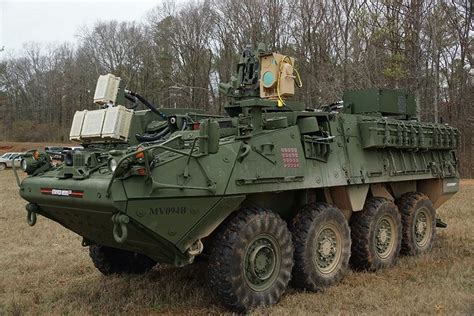 Us Soldiers Ready To Use Laser Weapon Mehel Mounted On Stryker