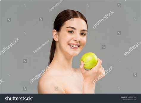 Cheerful Naked Woman Smiling While Holding Stock Photo