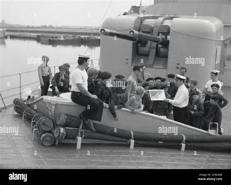 1970s Aboard The Hms Ajax The Ships Captain Showing A Picture To The